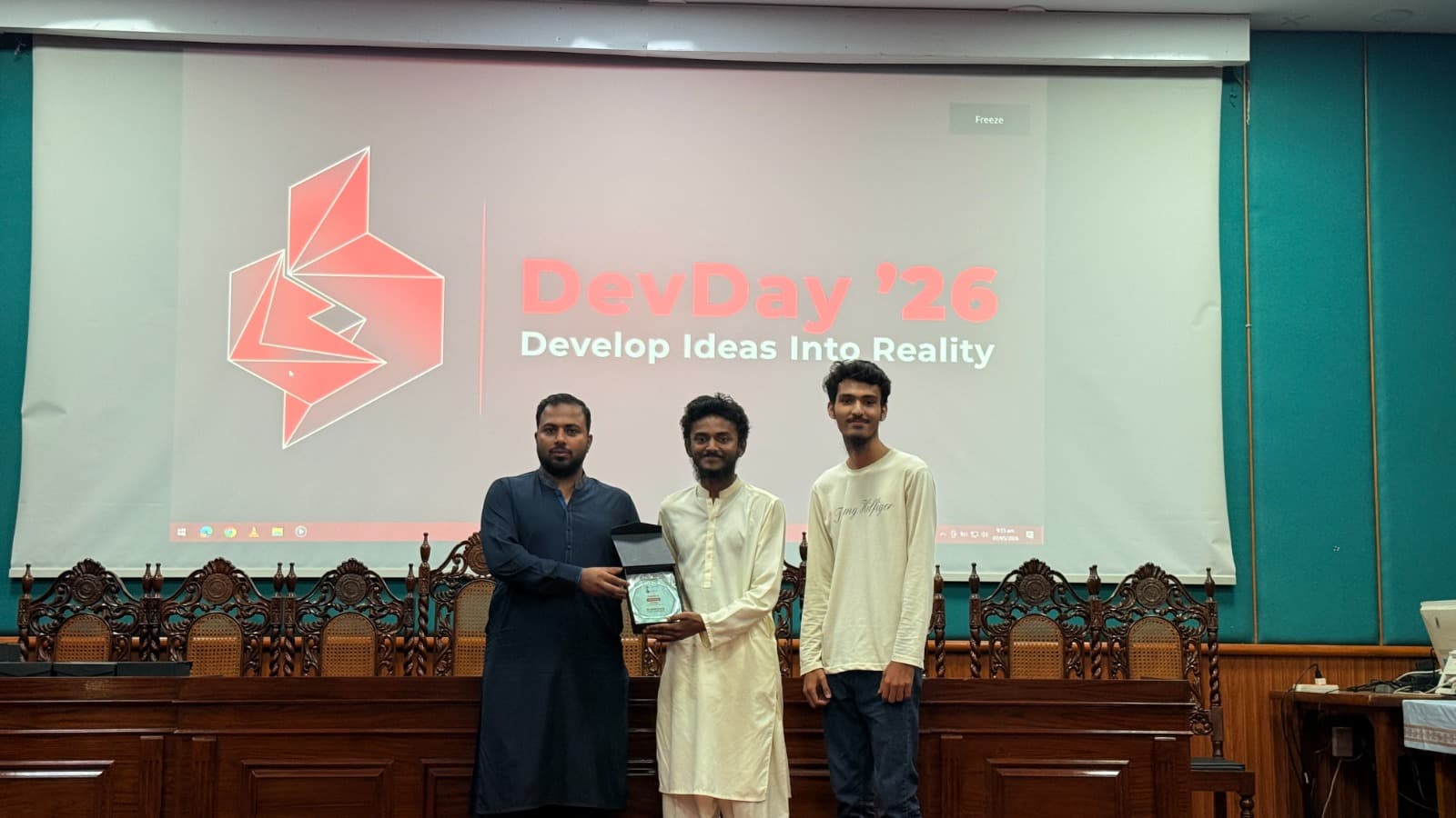 Receiving the Code Sprint trophy at Devday '26